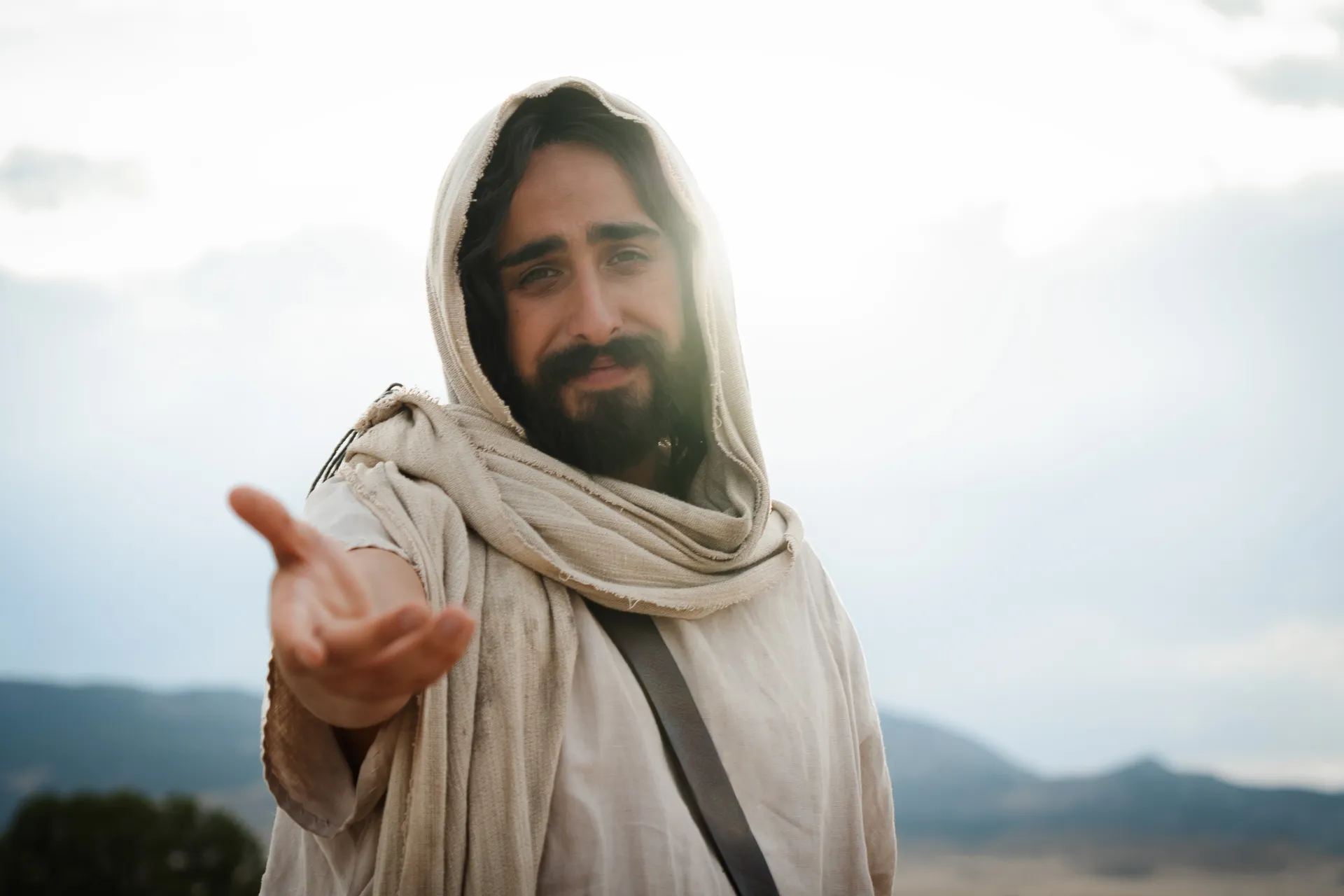 Depiction of Jesus Christ reaching his hand out, beckoning all to come follow Him. Detail from the Easter 2026 campaign. © undefined ipCode 1.