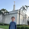 Smiling boy in front of the temple