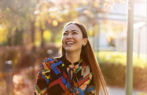 a young adult woman smiling