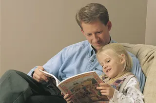 father and daughter reading
