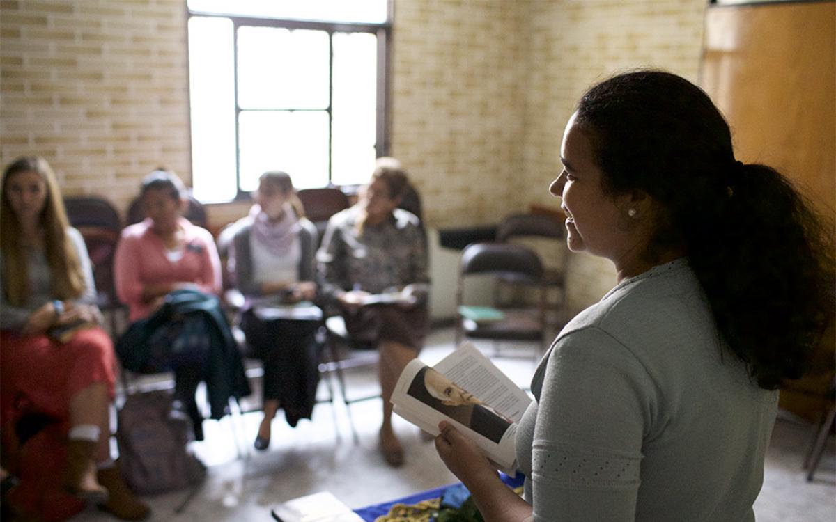Youth in class being taught by an instructor.